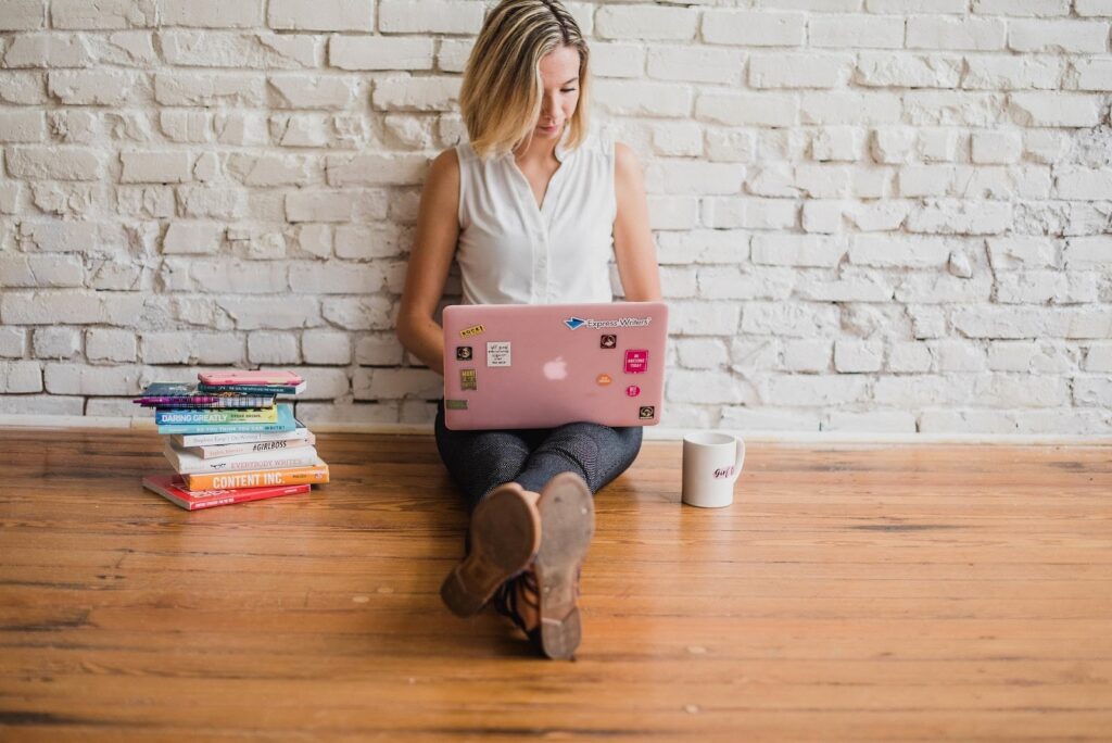 Woman working on a laptop.