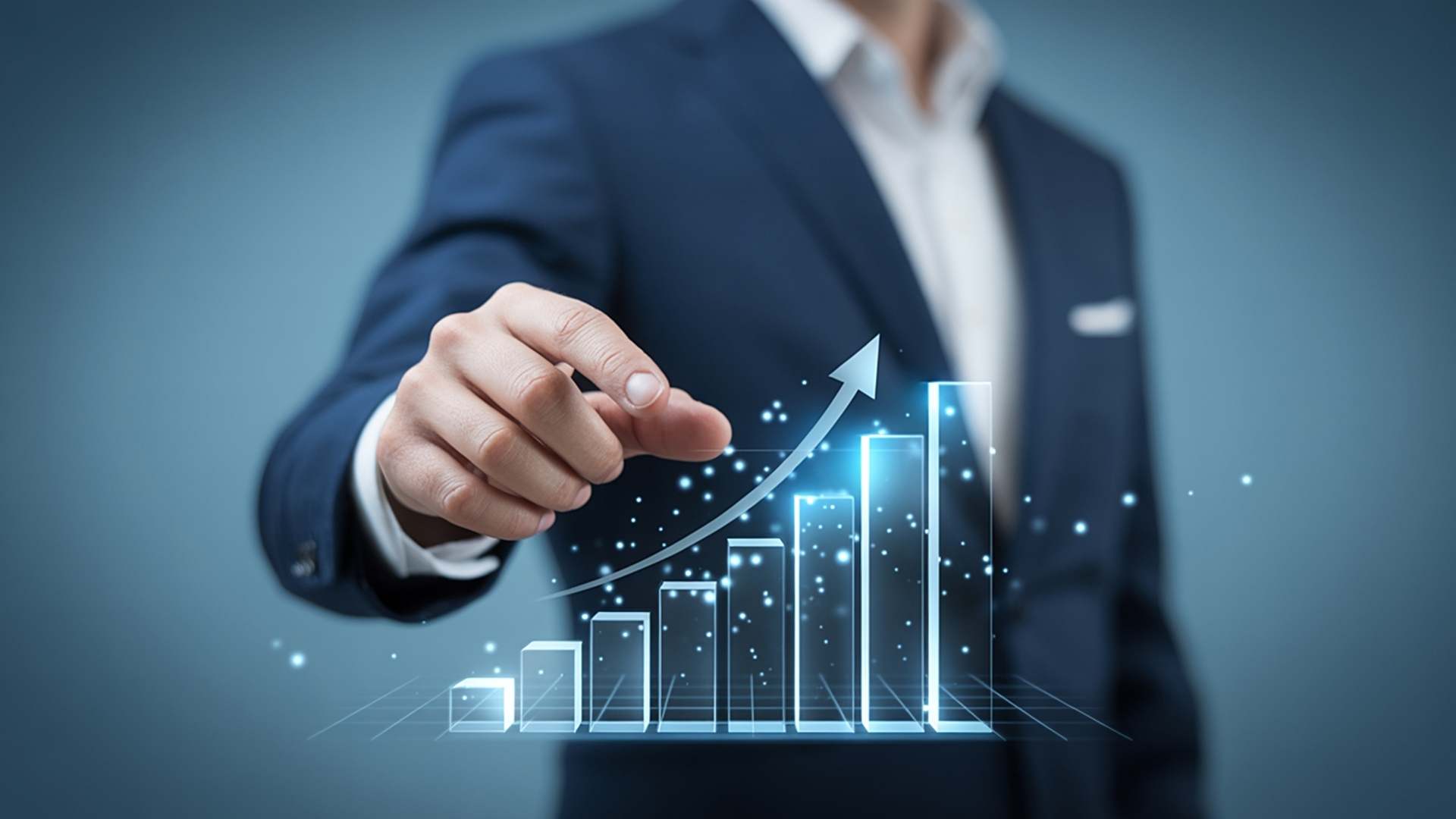 Business professional pointing at an upward growth chart