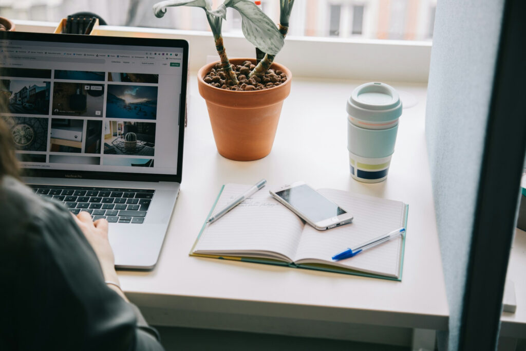 Freelancer organizing visual content, notes, and digital assets for social media client work