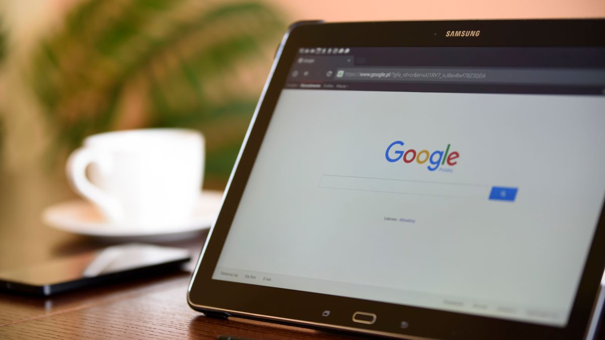 Samsung tablet on desk showing Google homepage, perfect for technology-related content.