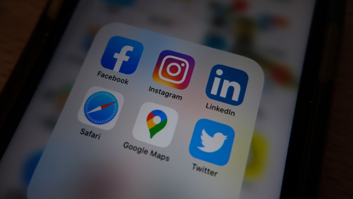 Close-up view of popular social media app icons on a smartphone screen.