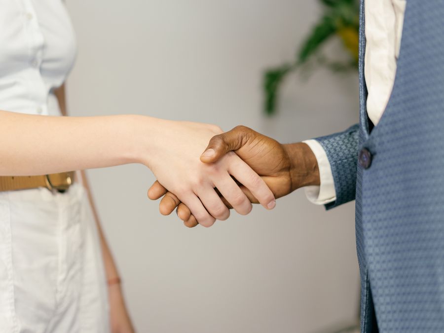 Close-up of a professional handshake symbolizing agreement and partnership in business.