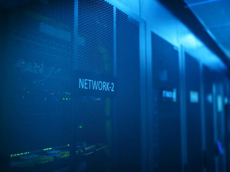 A modern server room featuring network equipment with blue illumination. Ideal for technology themes.