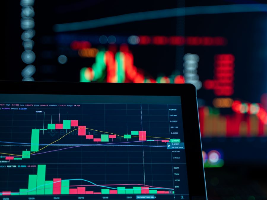 Close-up view of digital trading chart screen with vibrant graphs and data analysis.