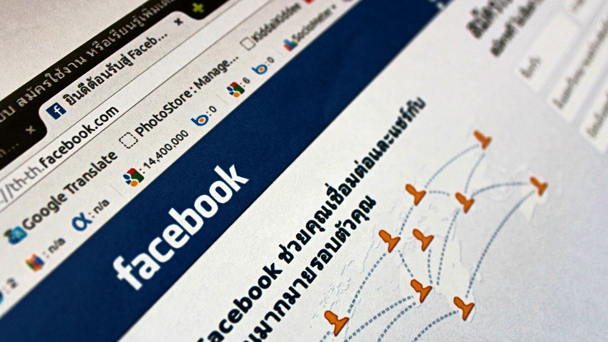 Close-up view of a Facebook webpage displayed on a browser with social media icons.