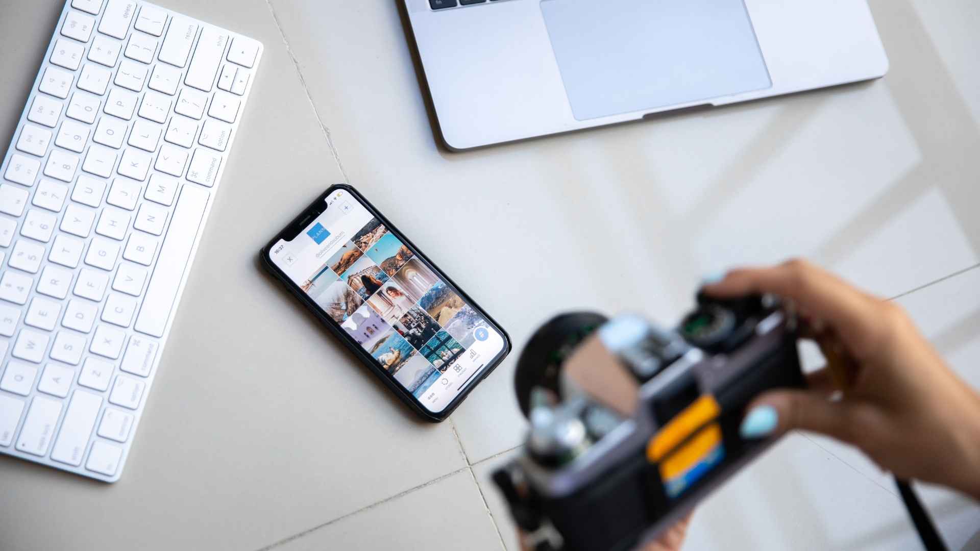creator using a camera and smartphone