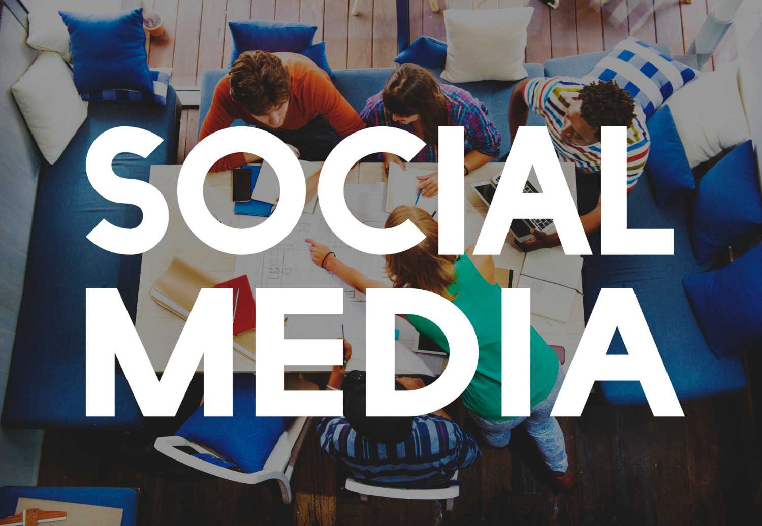 Social media marketing team collaborating on digital campaign planning