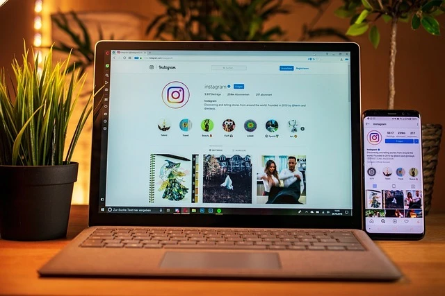Instagram profile displayed on a laptop and smartphone